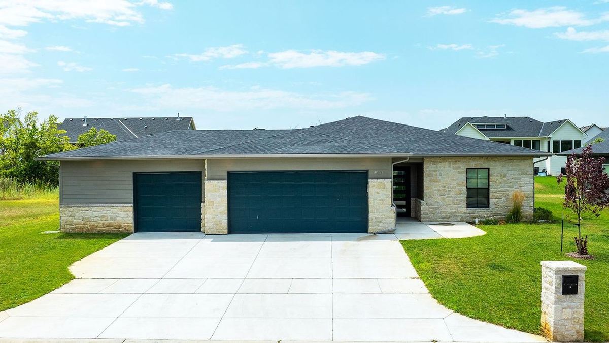 RJ Castle Homes stone-and-siding ranch at Emerald Bay Estates, one of its Wichita, KS home communities