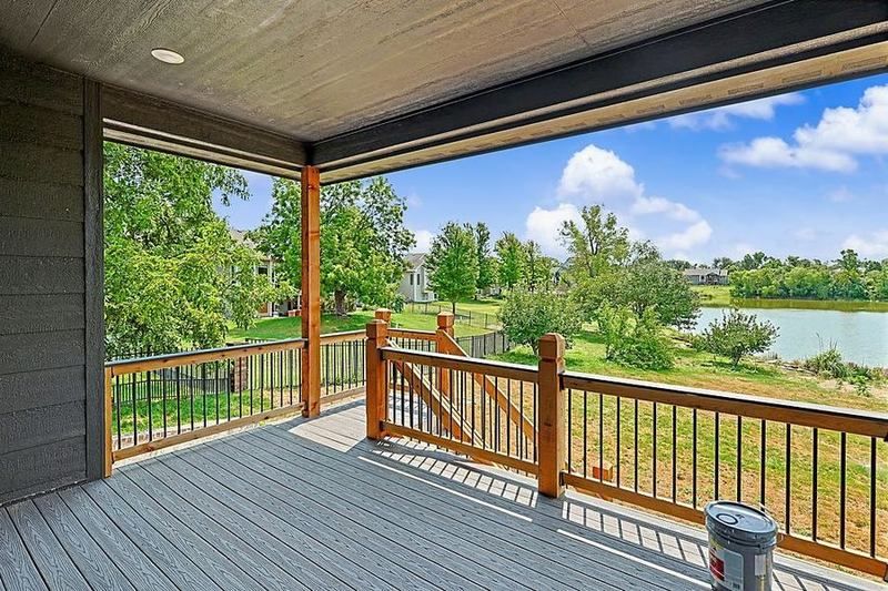 Covered rear deck looking out over the lake at the RJ Castle home on Sunflower Drive – Derby, KS